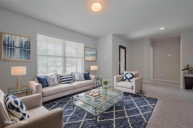 6907 Arcadia Meadow Ct, Richmond, TX 77407 - living area featuring baseboards and light tile patterned floors