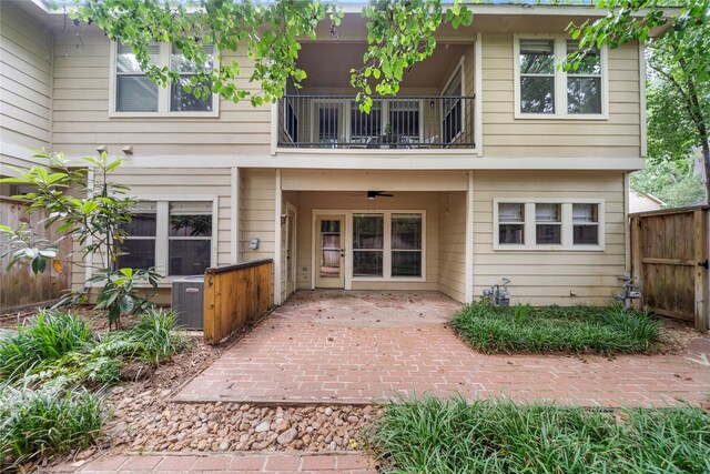 150 N Magnolia Pond Pl, The Woodlands, TX 77381 - back of house with a balcony and a patio
