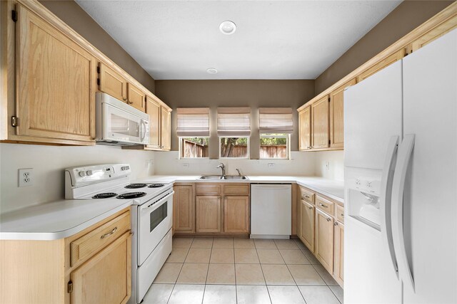 150 N Magnolia Pond Pl, The Woodlands, TX 77381 - kitchen featuring white appliances, a sink, and light brown cabinets