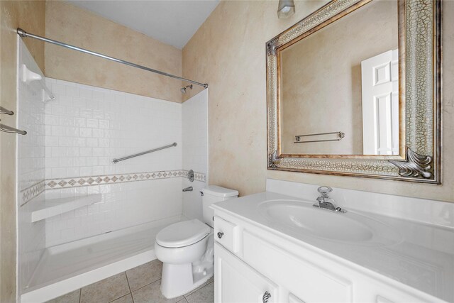 150 N Magnolia Pond Pl, The Woodlands, TX 77381 - full bathroom with vanity, toilet, a tile shower, and tile patterned flooring