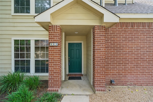 150 N Magnolia Pond Pl, The Woodlands, TX 77381 - property entrance featuring brick siding