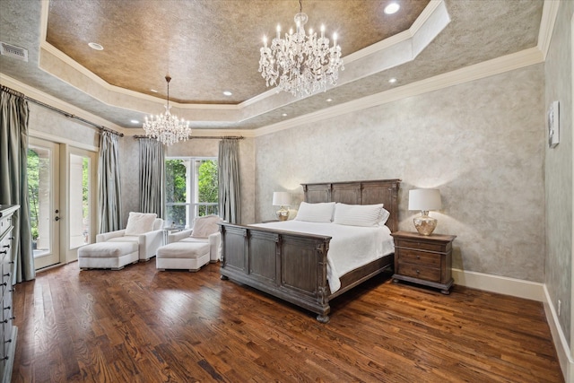 bedroom featuring a raised ceiling, an inviting chandelier, dark wood-style flooring, and access to exterior