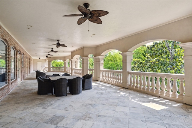 view of patio with outdoor dining space and ceiling fan