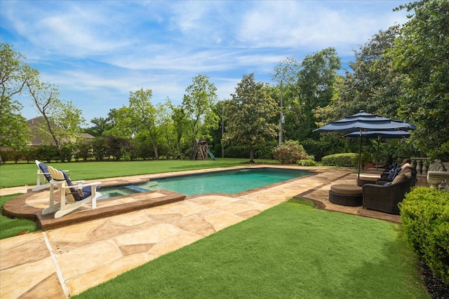 outdoor pool with a lawn, a patio, an in ground hot tub, and a playground