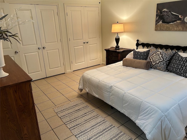 bedroom with light tile patterned flooring