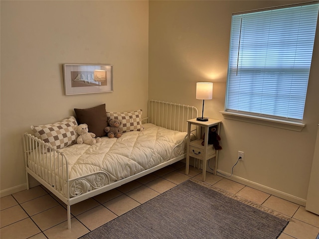 tiled bedroom with baseboards