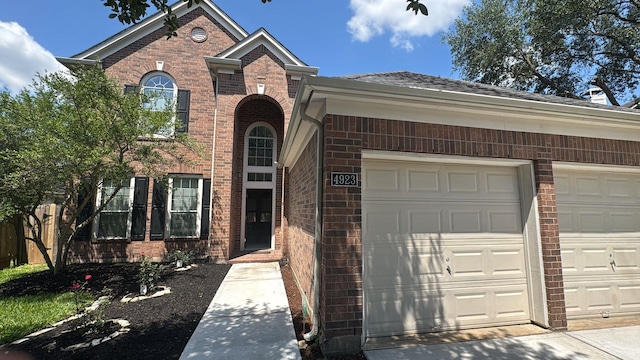 4923 Lake Gladewater Ct, Richmond, TX 77407 - view of front facade featuring brick siding and a garage
