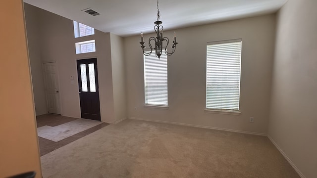 4923 Lake Gladewater Ct, Richmond, TX 77407 - carpeted entrance foyer with a chandelier and baseboards