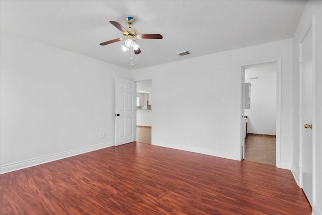 unfurnished bedroom featuring baseboards, wood finished floors, visible vents, and a ceiling fan
