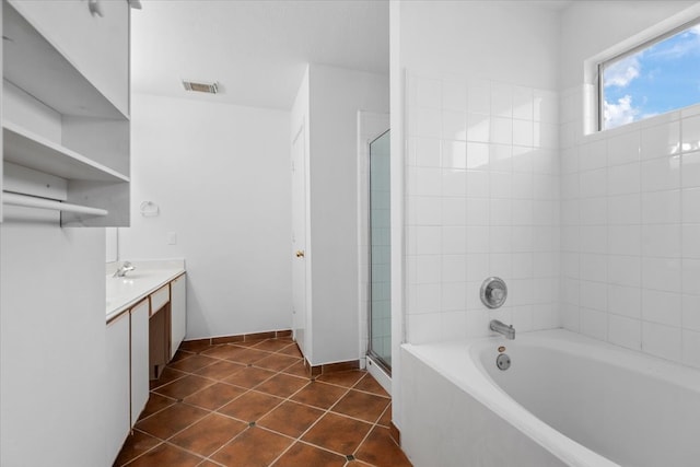 full bathroom featuring a shower stall, tile patterned floors, visible vents, vanity, and a bath
