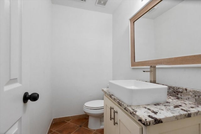 bathroom featuring toilet, baseboards, visible vents, tile patterned flooring, and vanity