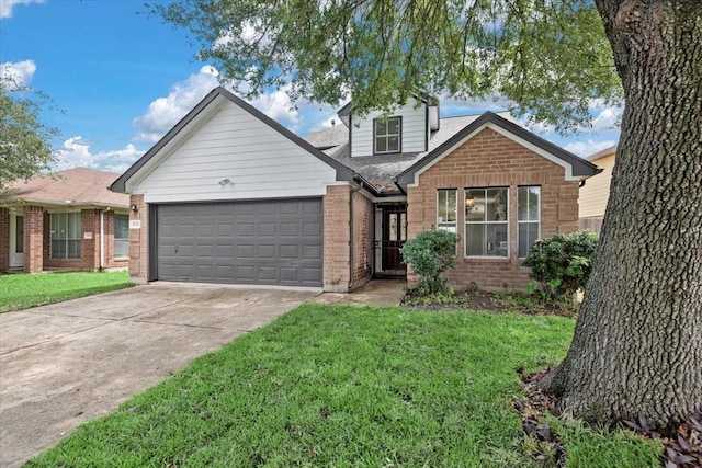view of front of house with a shingled roof, a front lawn, concrete driveway, brick siding, and a garage