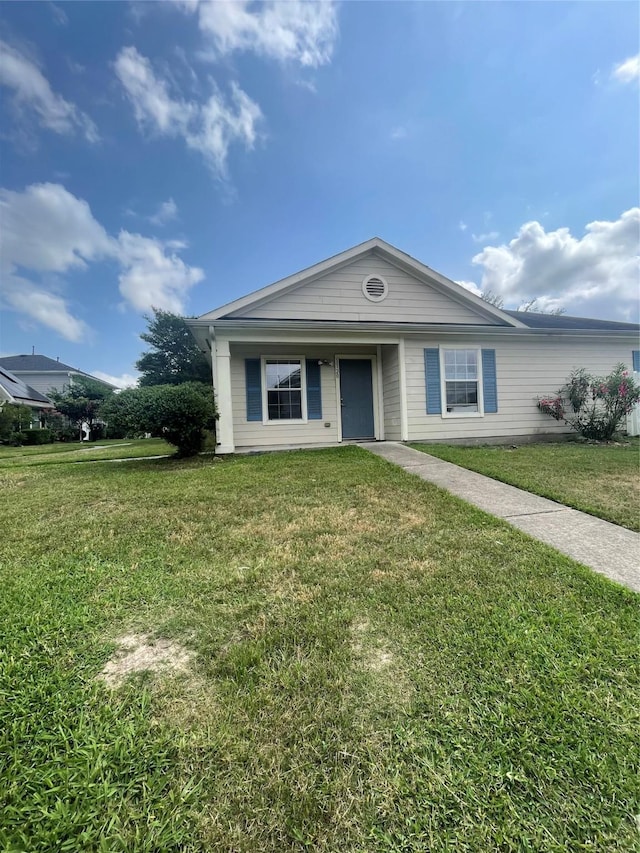 view of front of home with a front lawn