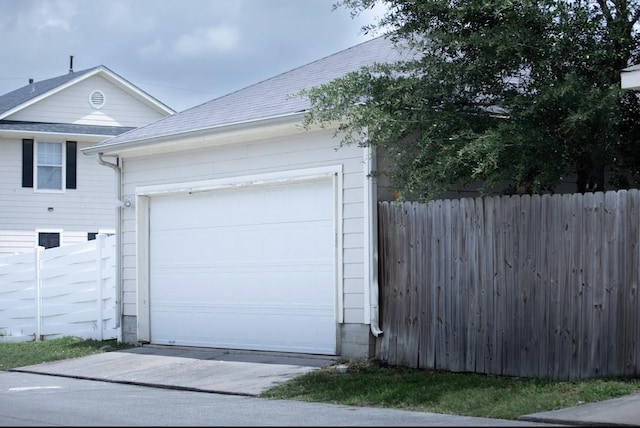 garage featuring fence