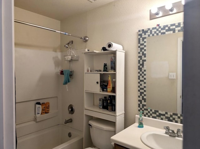 bathroom featuring toilet, washtub / shower combination, and vanity