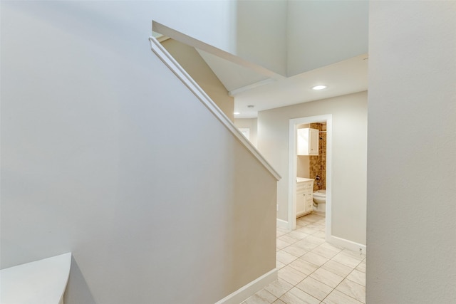 staircase with recessed lighting, tile patterned flooring, and baseboards