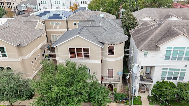 view of front of home with a residential view and stucco siding