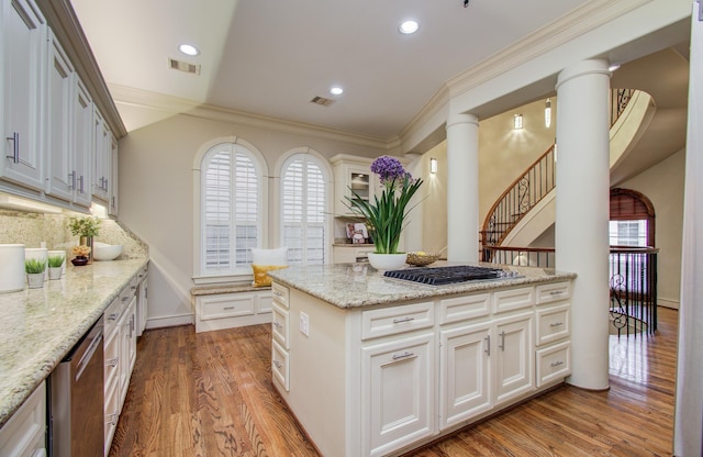 kitchen with wood finished floors, visible vents, and stainless steel appliances