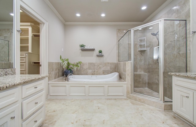 full bathroom featuring recessed lighting, ornamental molding, vanity, and a stall shower