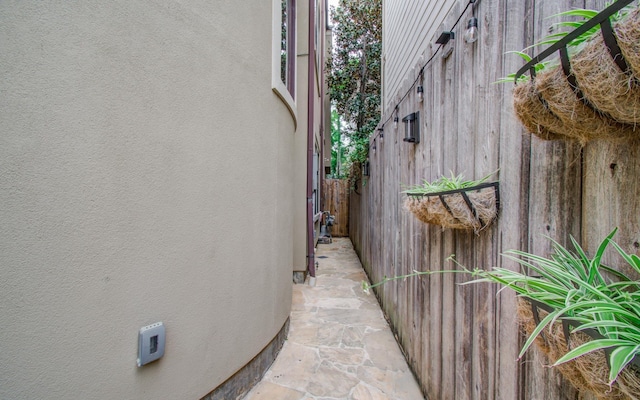 view of side of home featuring crawl space and stucco siding