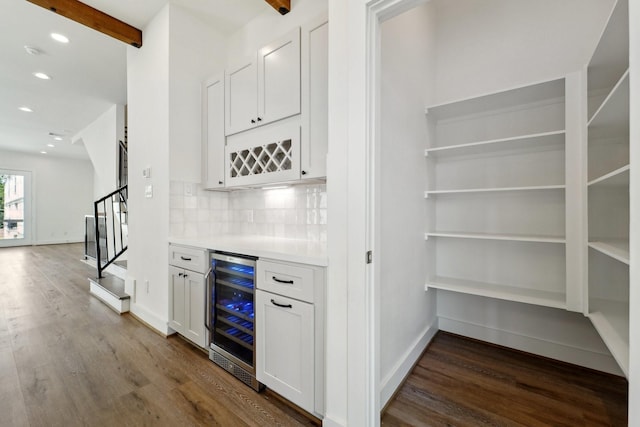 2520 Ohsfeldt St, Houston, TX 77008 - indoor dry bar with wine cooler, dark wood-style flooring, stairway, recessed lighting, and decorative backsplash