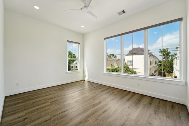 2520 Ohsfeldt St, Houston, TX 77008 - spare room with wood finished floors, ceiling fan, baseboards, and recessed lighting