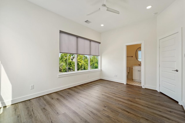 2520 Ohsfeldt St, Houston, TX 77008 - unfurnished bedroom with baseboards, recessed lighting, wood finished floors, connected bathroom, and a ceiling fan