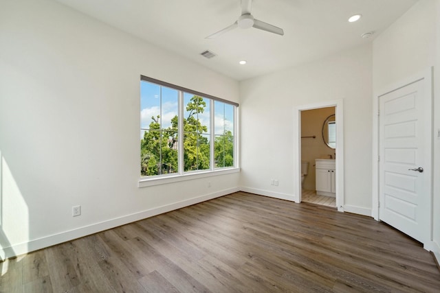 2520 Ohsfeldt St, Houston, TX 77008 - unfurnished bedroom with baseboards, dark wood-style flooring, recessed lighting, ensuite bathroom, and a ceiling fan