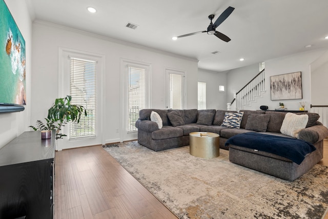 living area featuring visible vents, wood finished floors, stairway, recessed lighting, and a ceiling fan