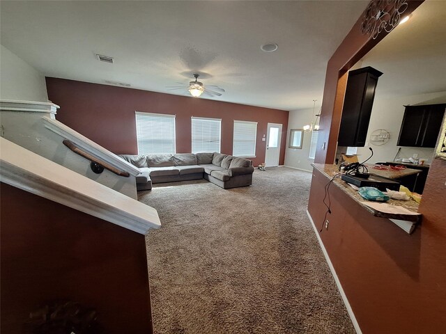 211 Sea Breeze Dr, Bacliff, TX 77518 - living area featuring baseboards, visible vents, carpet floors, and ceiling fan