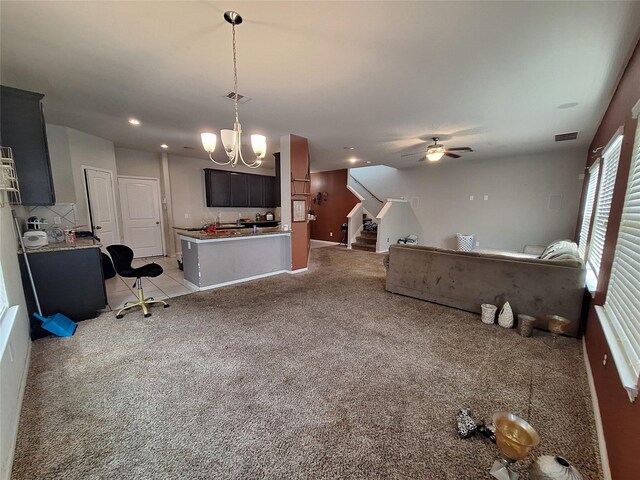 211 Sea Breeze Dr, Bacliff, TX 77518 - interior space featuring ceiling fan with notable chandelier, visible vents, light colored carpet, and stairs