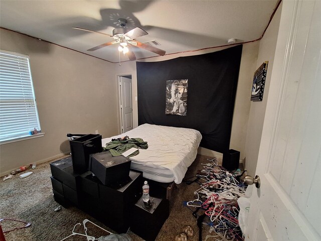 211 Sea Breeze Dr, Bacliff, TX 77518 - bedroom with carpet floors, a ceiling fan, and baseboards