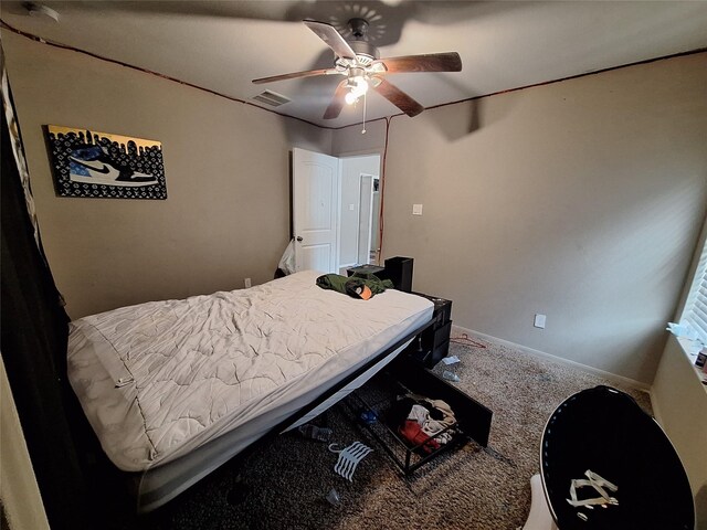 211 Sea Breeze Dr, Bacliff, TX 77518 - bedroom with baseboards, a ceiling fan, carpet flooring, and visible vents