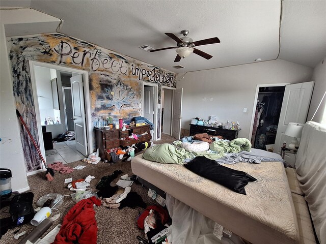 211 Sea Breeze Dr, Bacliff, TX 77518 - bedroom with a closet, vaulted ceiling, visible vents, and a ceiling fan