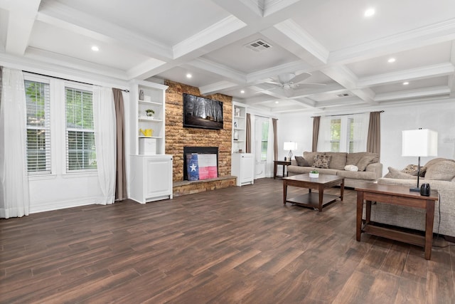 living area featuring a ceiling fan, visible vents, a fireplace, and dark wood-style floors