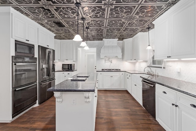 kitchen with an ornate ceiling, stainless steel appliances, white cabinetry, custom range hood, and dark wood-style flooring