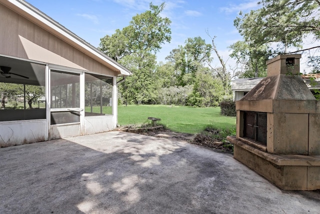 view of patio / terrace featuring a sunroom