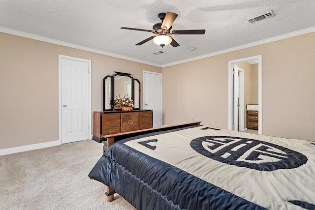 bedroom with visible vents, carpet flooring, baseboards, and ornamental molding
