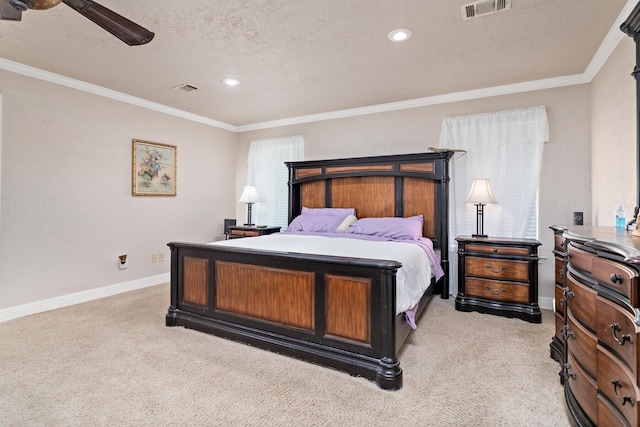 bedroom with recessed lighting, visible vents, baseboards, and light carpet