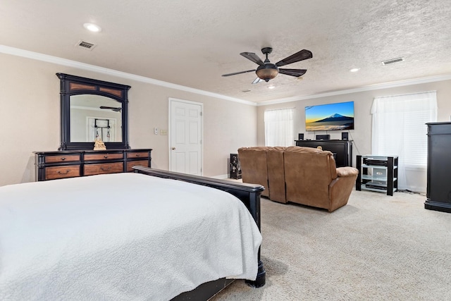 bedroom with visible vents, light colored carpet, and multiple windows