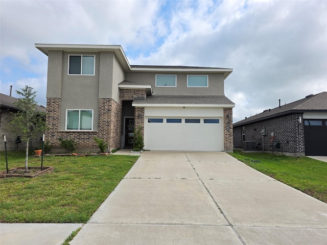 view of front of property with concrete driveway, brick siding, an attached garage, a front yard, and stucco siding