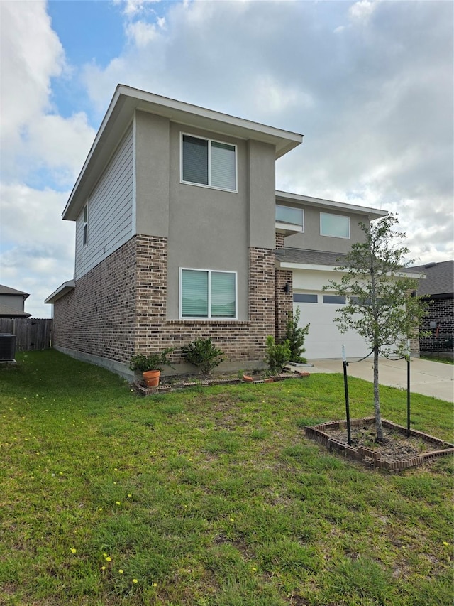 view of front of property with driveway, brick siding, an attached garage, a front yard, and stucco siding