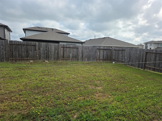 view of yard featuring a fenced backyard