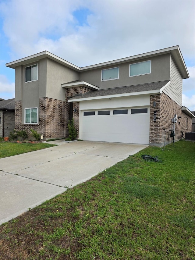 traditional-style home with brick siding, stucco siding, a front lawn, and concrete driveway