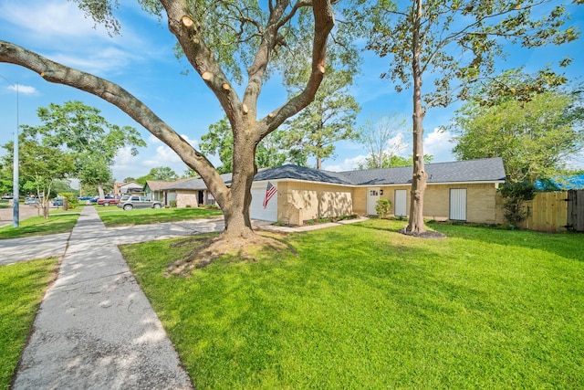 view of front of property with fence and a front yard