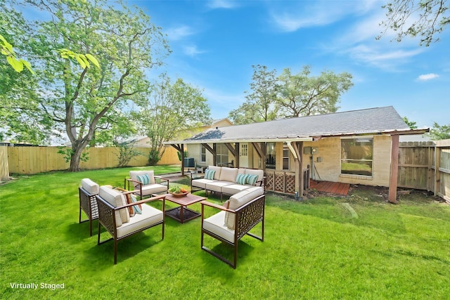 rear view of property featuring a yard, an outdoor hangout area, a wooden deck, and a fenced backyard