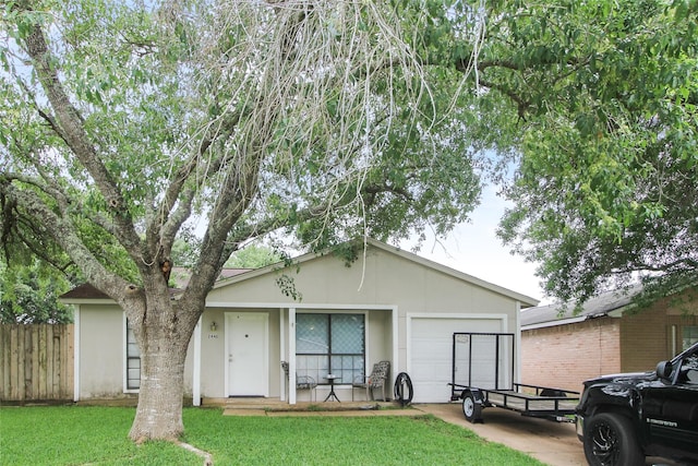 single story home with fence, stucco siding, a front yard, and a garage