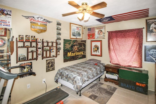 tiled bedroom featuring a ceiling fan