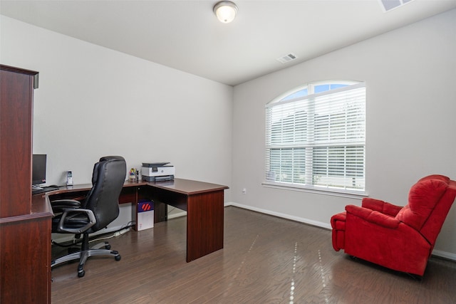 office featuring wood finished floors, visible vents, and baseboards