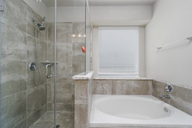 full bath with a shower stall and a bath